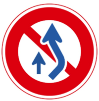 No crossing the center line for overtaking sign